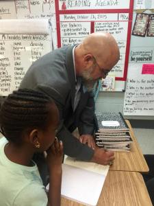 A student asking for an autograph.